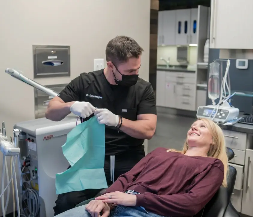 Dentist examining a patient during a checkup at Dental Elements in Shawnee, Leawood and Wellsville, KS